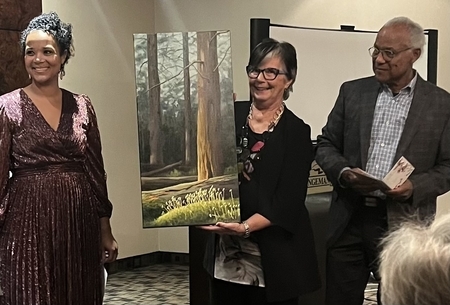 Philip and Alice Bruce receive “ Dew Drops and Moss “  for their retirement gift.